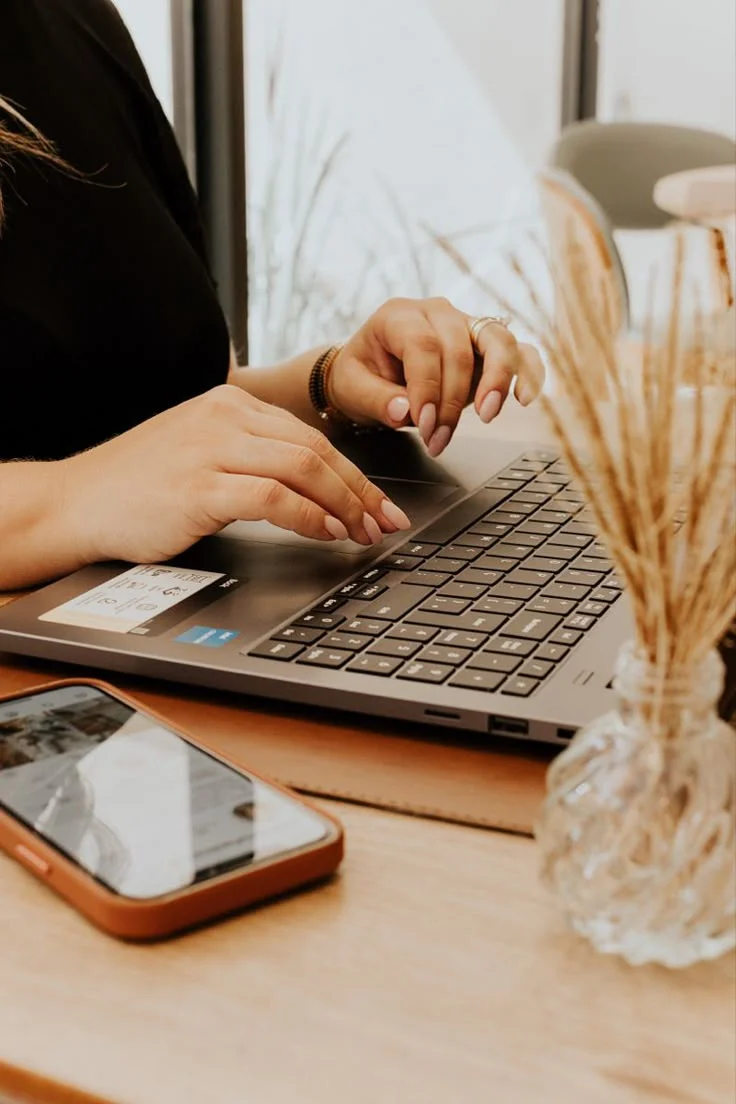 Digital marketing freelancer in Thrissur, crafting powerful strategies on her lap top in a inspiring workspace.